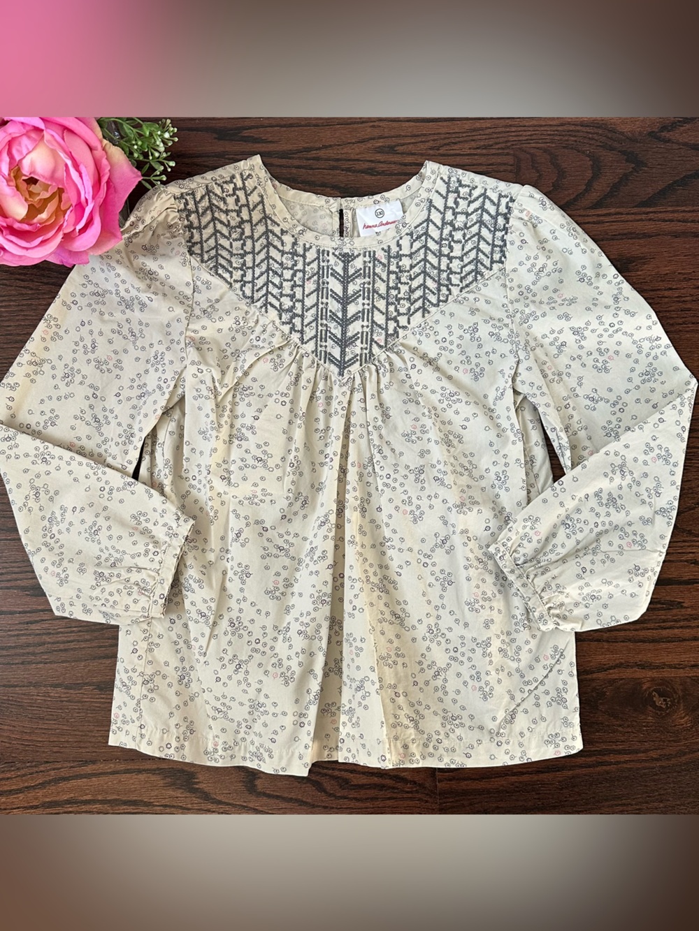 Hanna Andersson top with dark grey embroidery on the yoke, size 130/8US